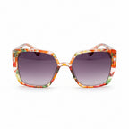 Sunglasses with a colorful frame on a wooden surface